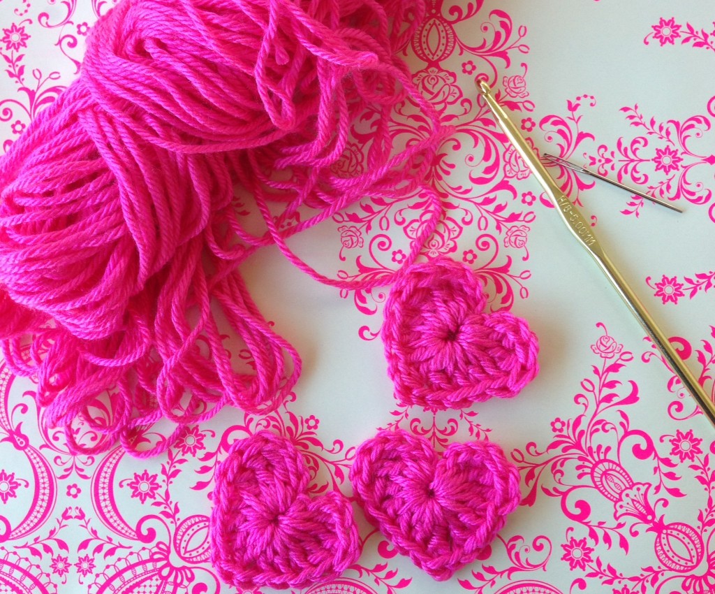 I made a few of these crocheted hearts two nights ago and attached safety pins so that they can be worn on Valentine's day.  This reminds me of a fond memory of when my mom made these for my class when I was in kindergarten.